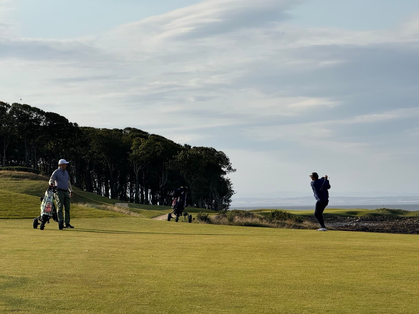 A links golf course on the Scottish coast at golden hour